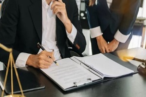lawyer signing documents