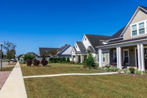 new construction neighborhood of hardy board cottage coastal style homes with landscaped yards