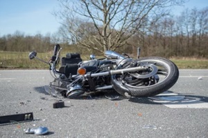 damaged motorcycle on Los Angeles highway after an accident